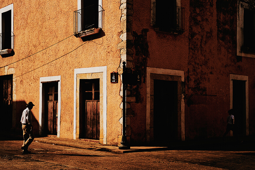 An old street corner with orange building