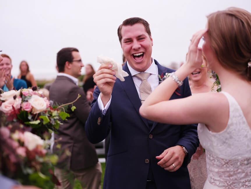 Professional photographer, Alison Conklin, on why the FUJIFILM GFX system is so good for location portrait photography. Image shows a bride laughing on his wedding day.