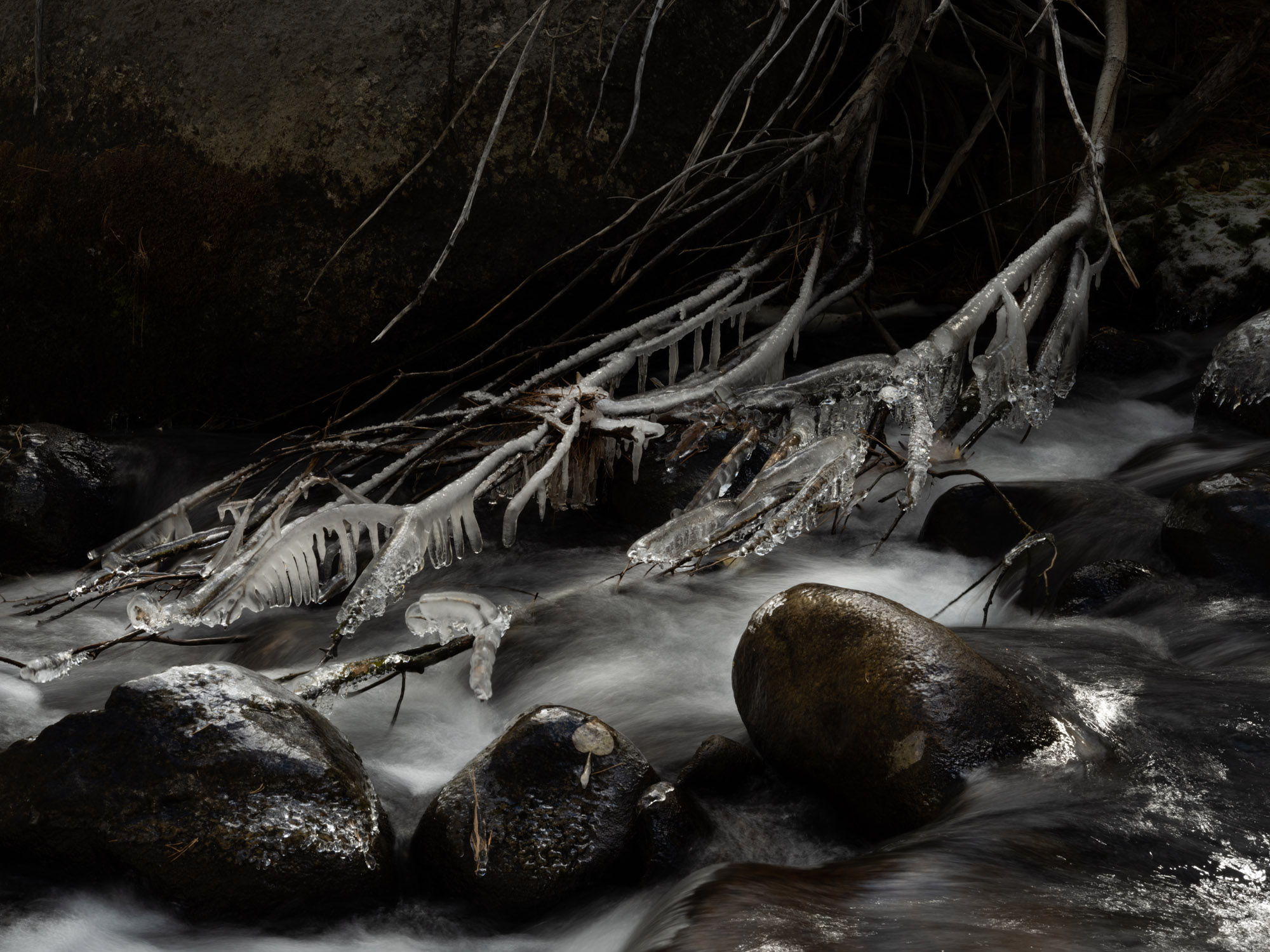 Long exposures of Yosemite's waters reveal wispy trails of water, contrasted with stunning icicles