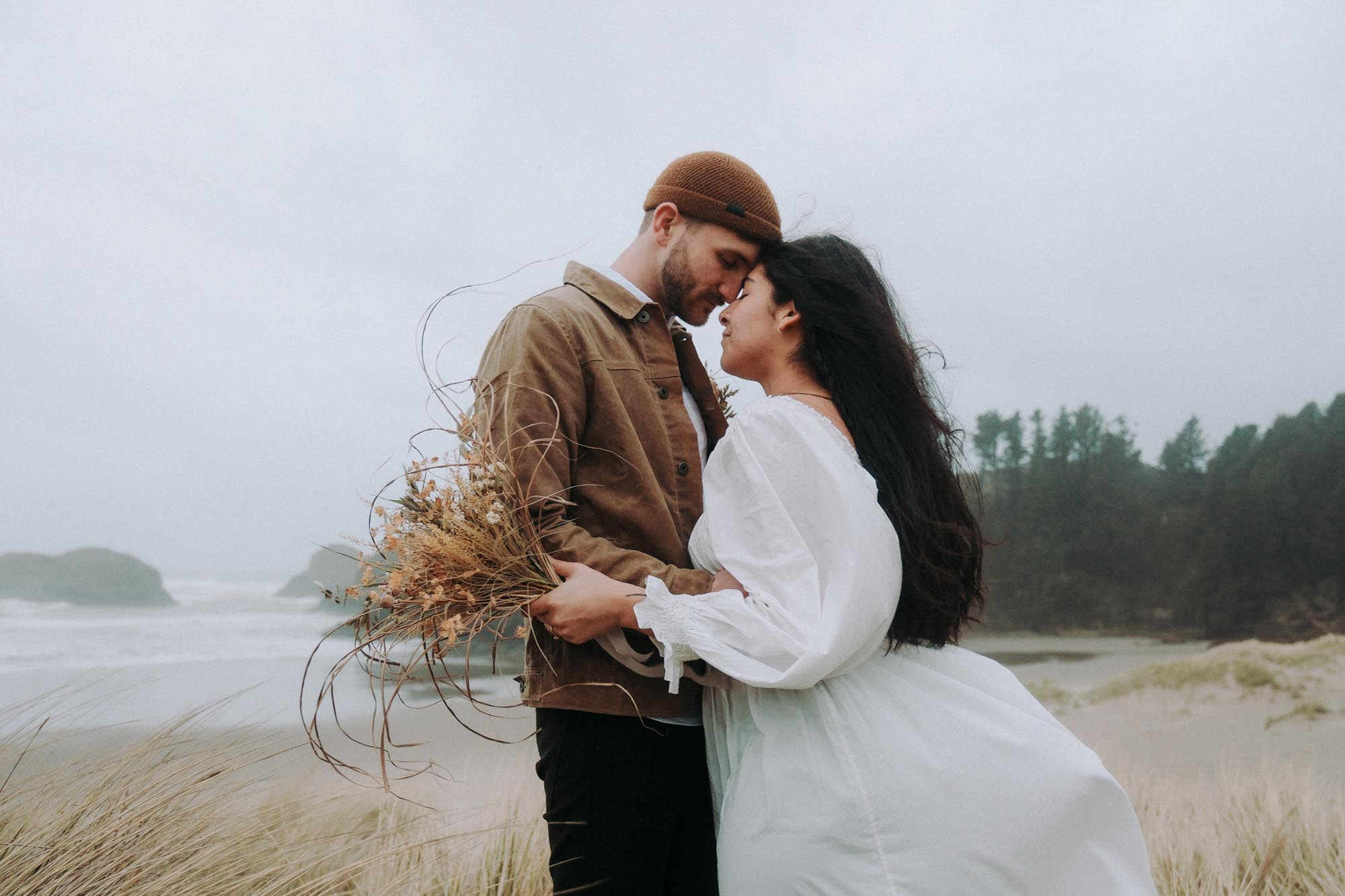 A couple embrace along the shoreline of Portland, Oregon