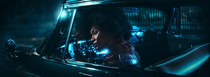 Woman waiting in the car with blue light