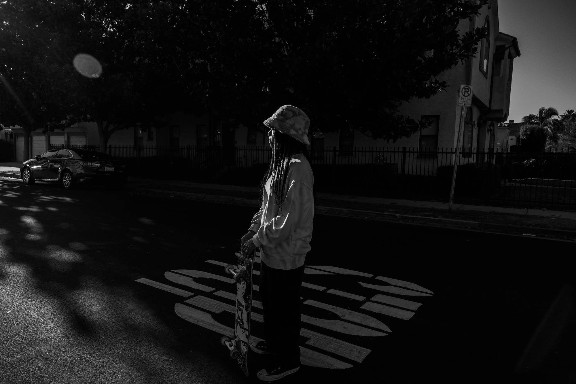 Black and white woman bucket hat with skateboard