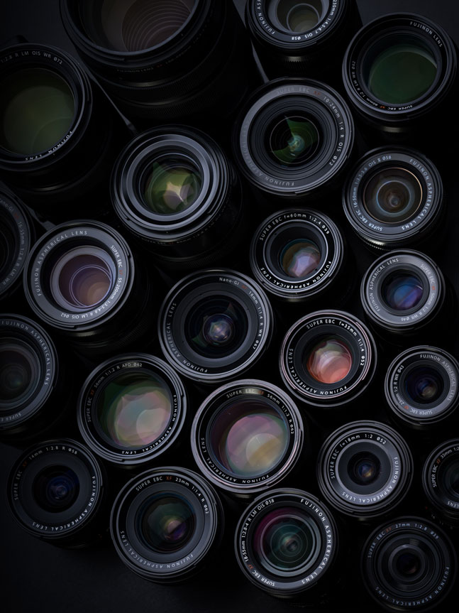 Flat lay photograph of a number FUJINON lenses