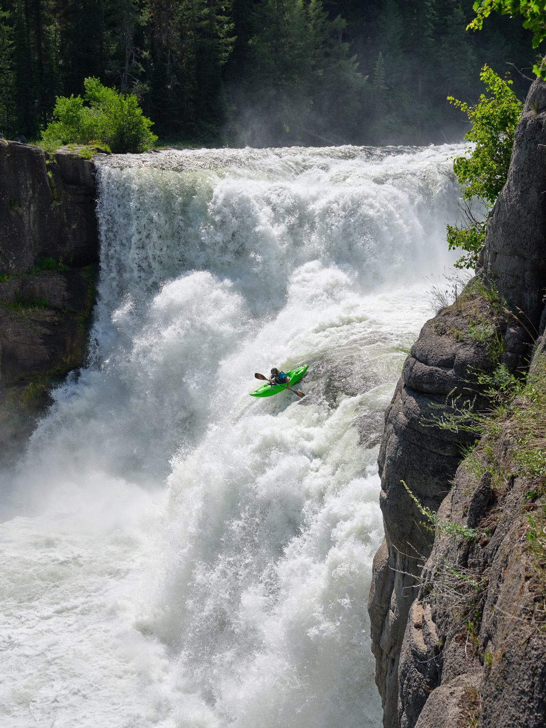 James Shimizu kayaking Lower Mesa Falls on the Henry's Fork River in Idaho.