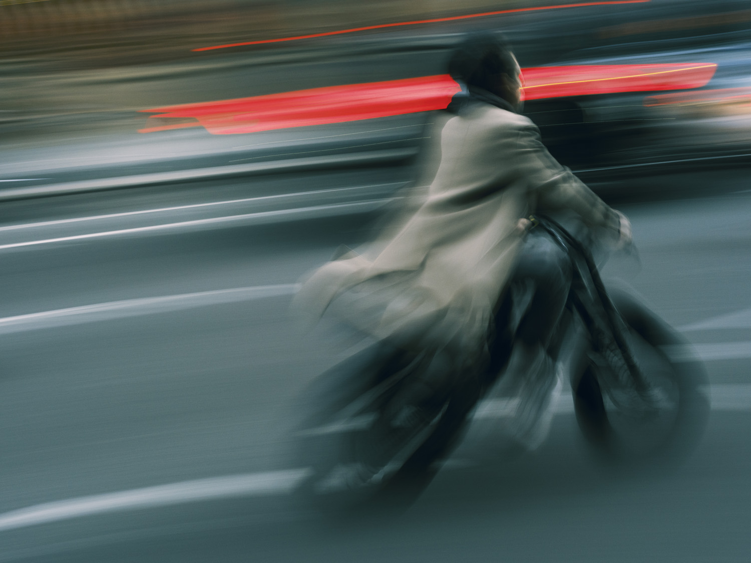 Blurred coloured image of person riding a motorcycle through New York